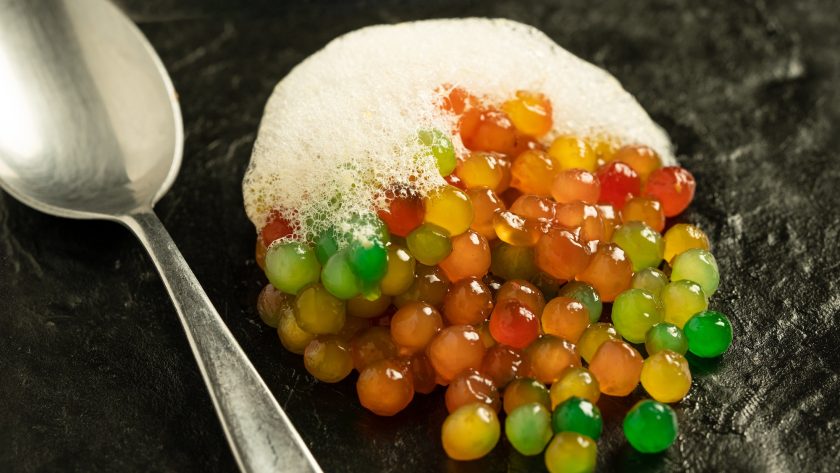 colorful molecular food with foam and spoon