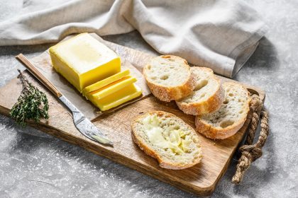 Farm butter and fresh baguette with butter.